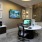a room with a desk and computer
