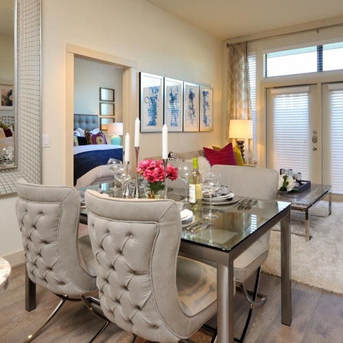Dining areas that connect with bedrooms a room with a table and chairs