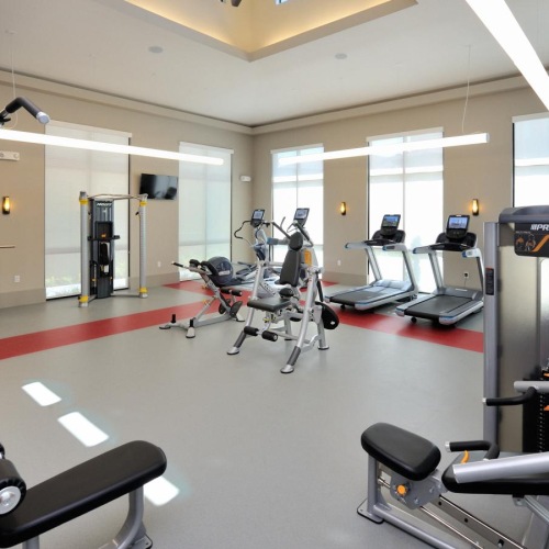 Settle into comfort at Broadstone Energy Park a gym with exercise equipment